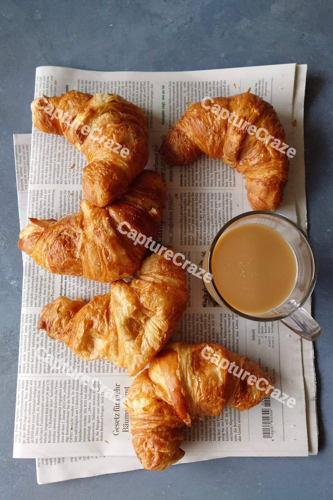 Croissants on a wooden chopping board